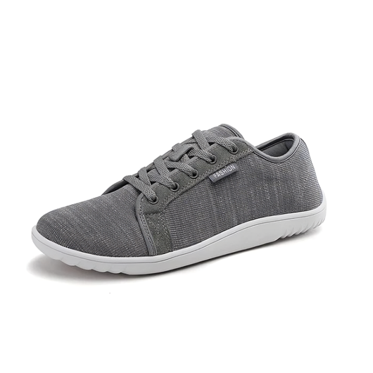 Grå minimalistisk barfotsko unisex med bred tåboks og hvit zero drop-sål mot hvit bakgrunn